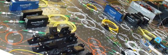 The project uses fiber-optic devices that make ultrafast calculations with photons of light instead of the electrons used by electricity-based computers circuits.